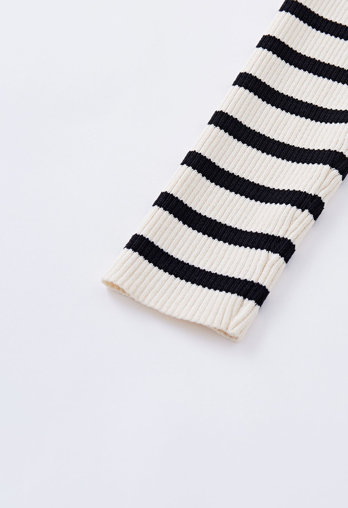 Folded Off-Shoulder Striped Knit Top in Black
