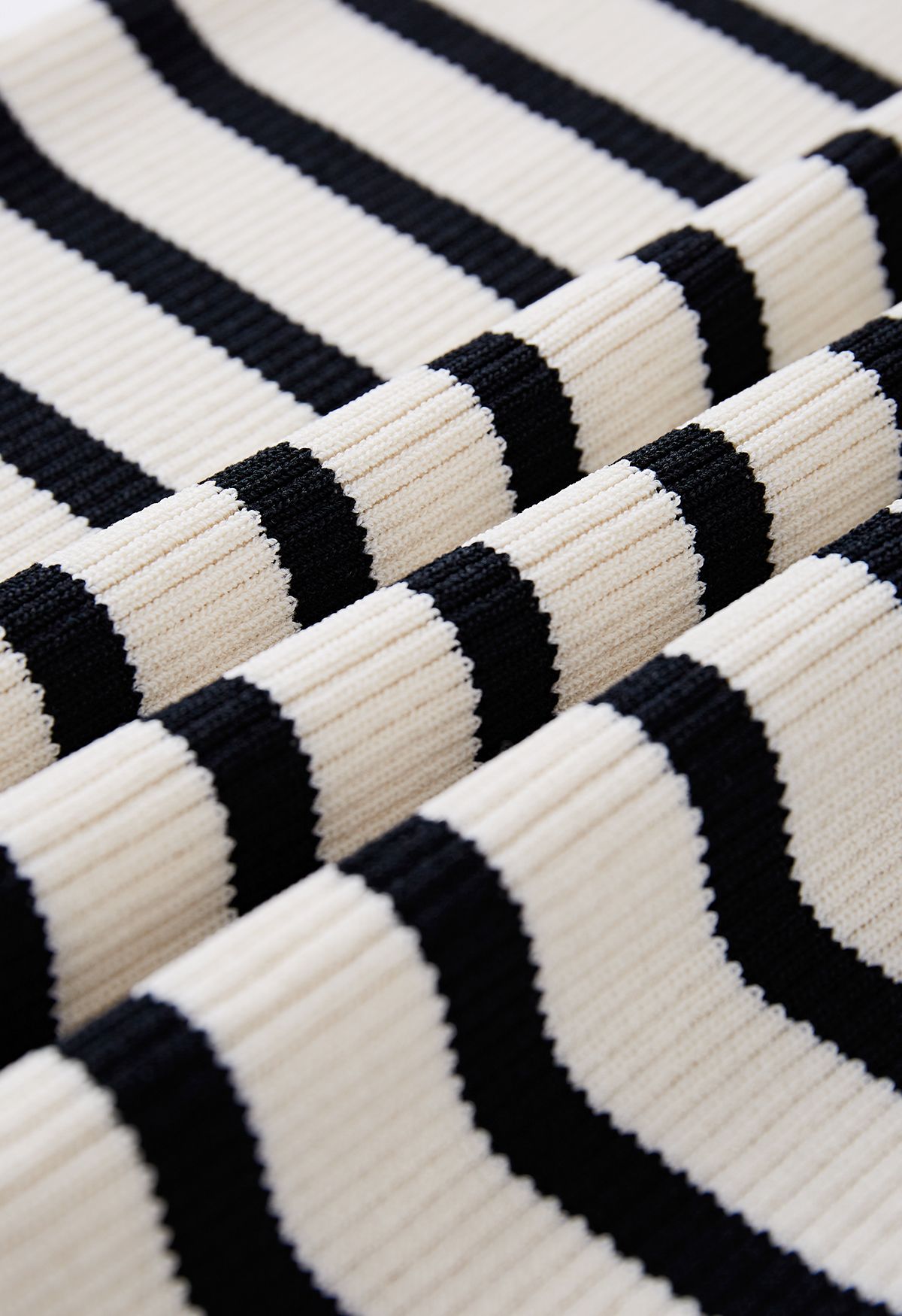 Folded Off-Shoulder Striped Knit Top in Black