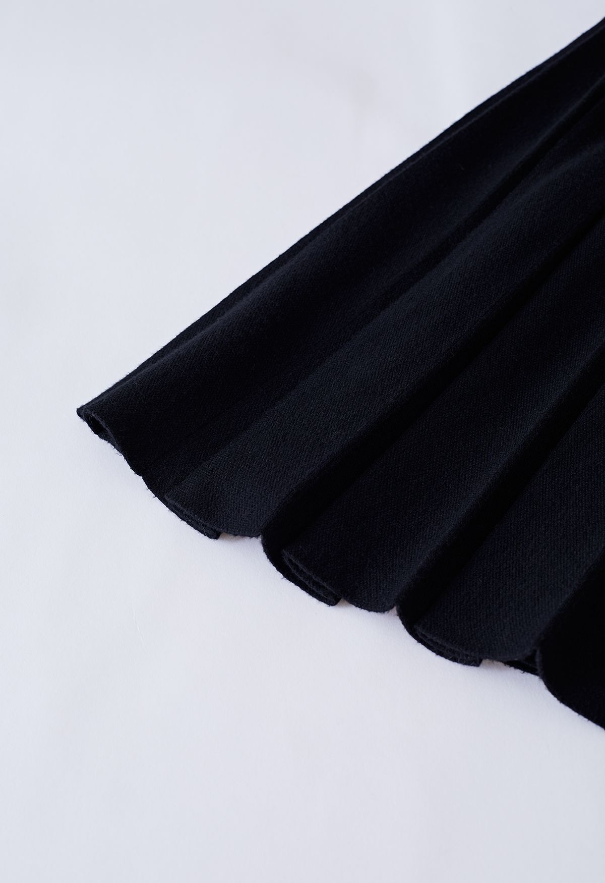 Buttoned Pleated Knit Midi Skirt in Black