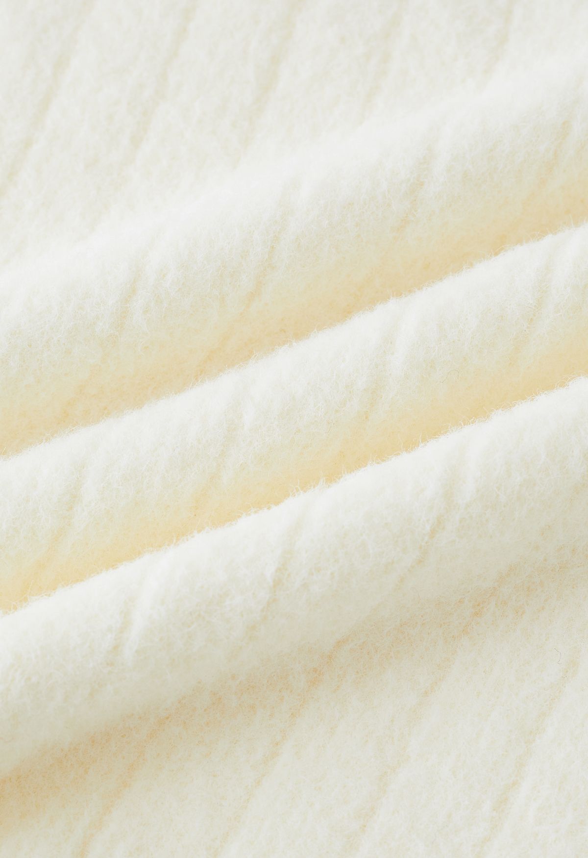 Cold-Shoulder Twist Cutout Crop Knit Top in Cream