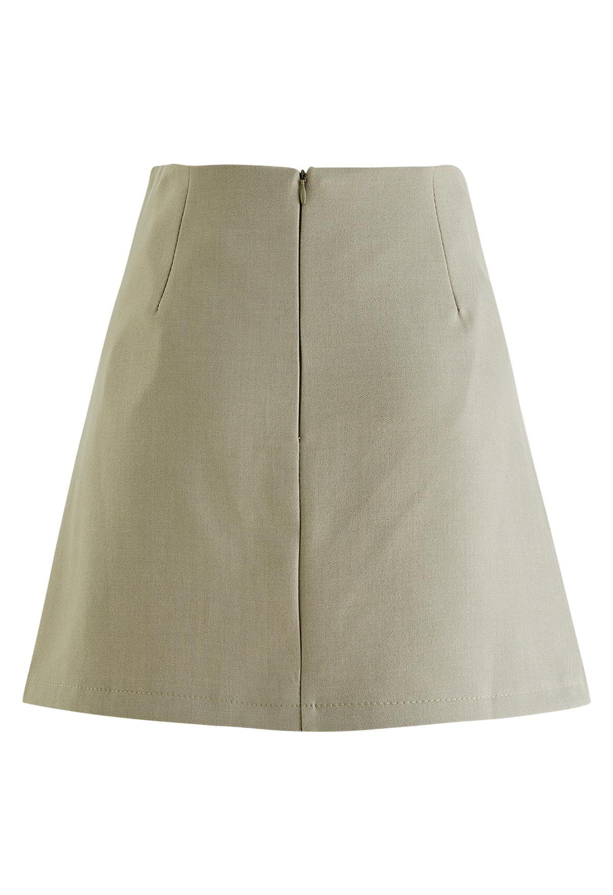 Twin Buttons Pleated Flap Mini Skirt in Khaki