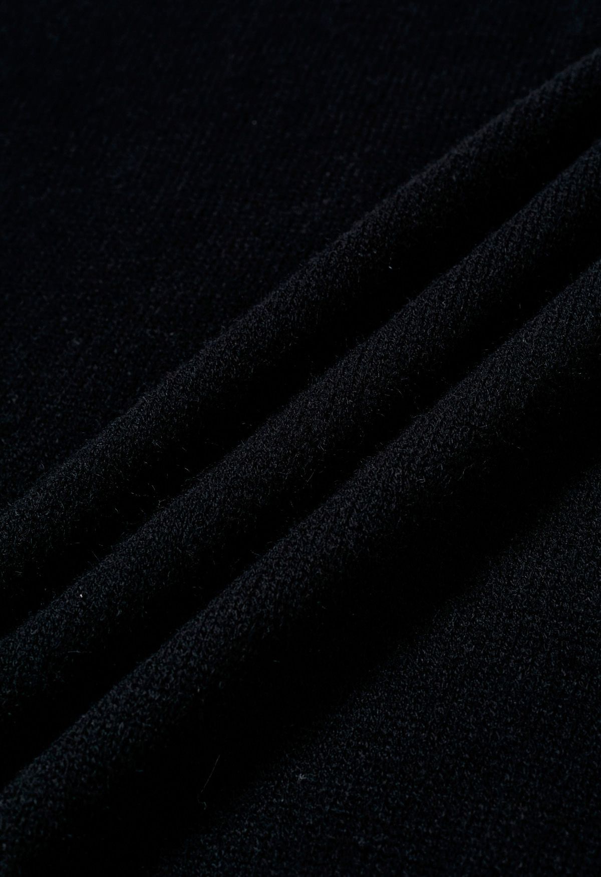 Dropped Shoulder Side Slit Slouchy Knit Sweater in Black