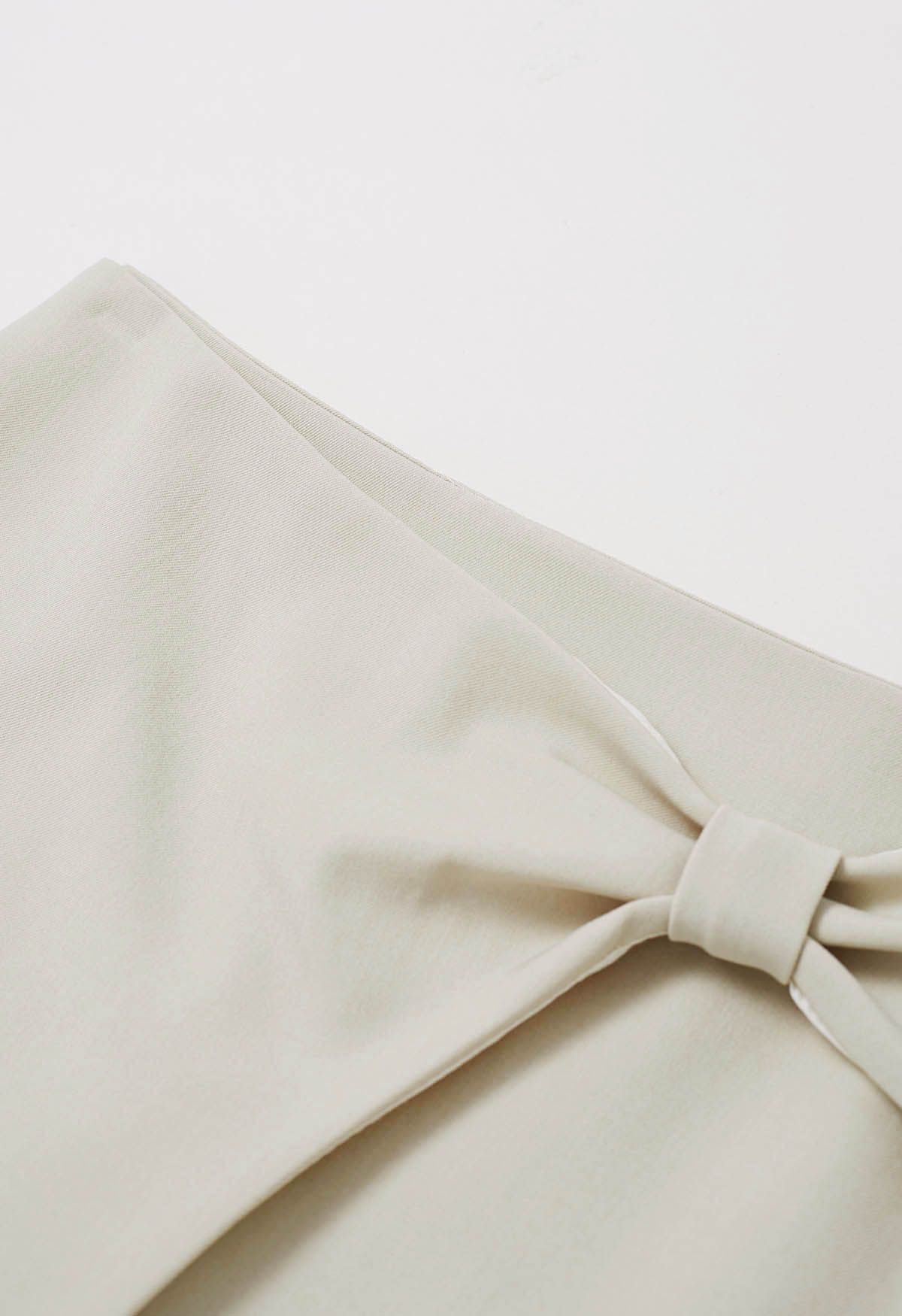 Graceful Bowknot Flap Mini Skirt in Sand