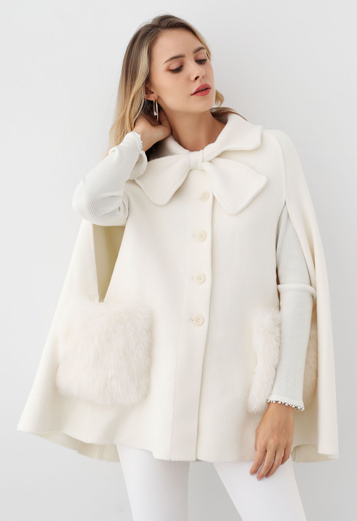 Bowknot Decor Faux Fur Pocket Buttoned Knit Cape Coat in Cream