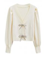 Sparkling Bowknot Buttoned Lantern Sleeve Knit Cardigan in Cream